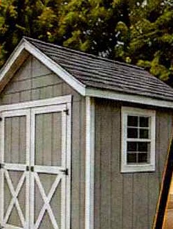 Gray storage shed with white trim